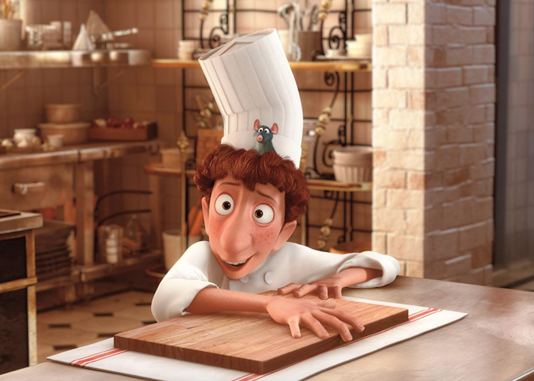 An animated still from Ratatouille showing Linguini and Remy in the kitchen.