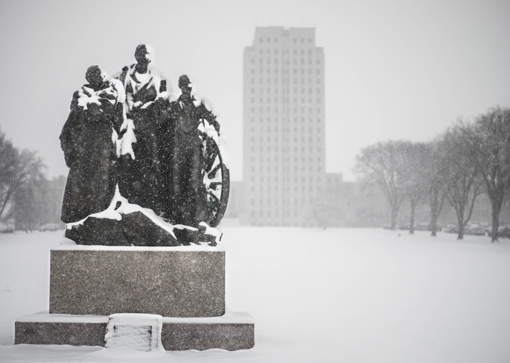 Snow falling on the state capitol.