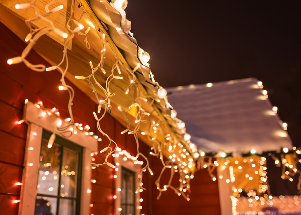 Close up of winter lights decorating a house.