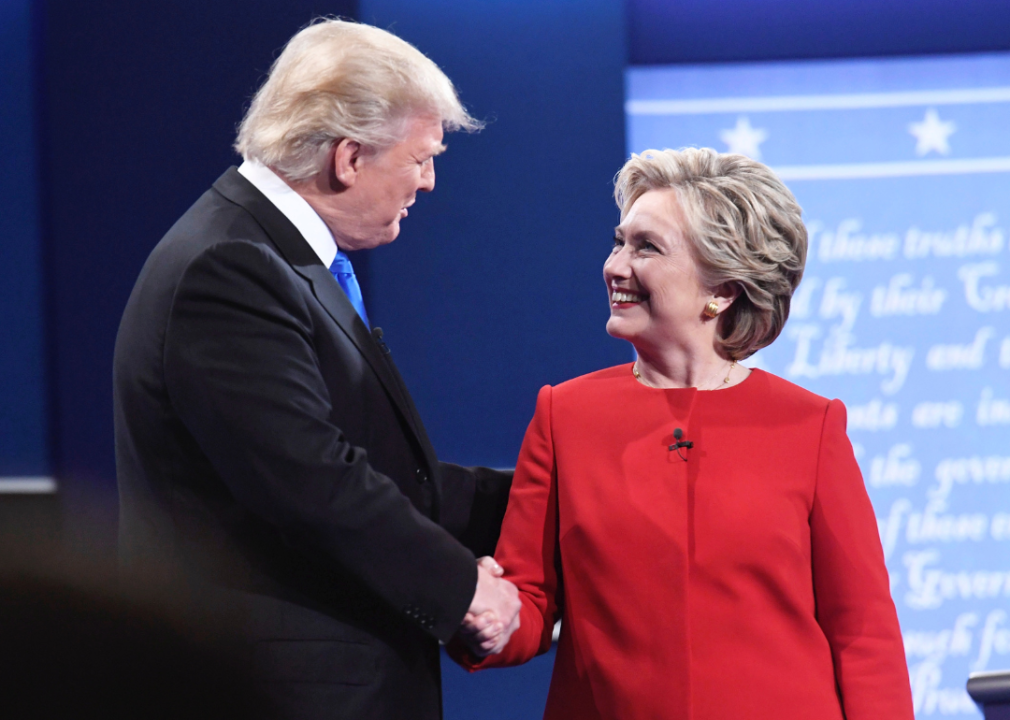 Donald Trump and Hillary Clinton shake hands at a 2016 debate.