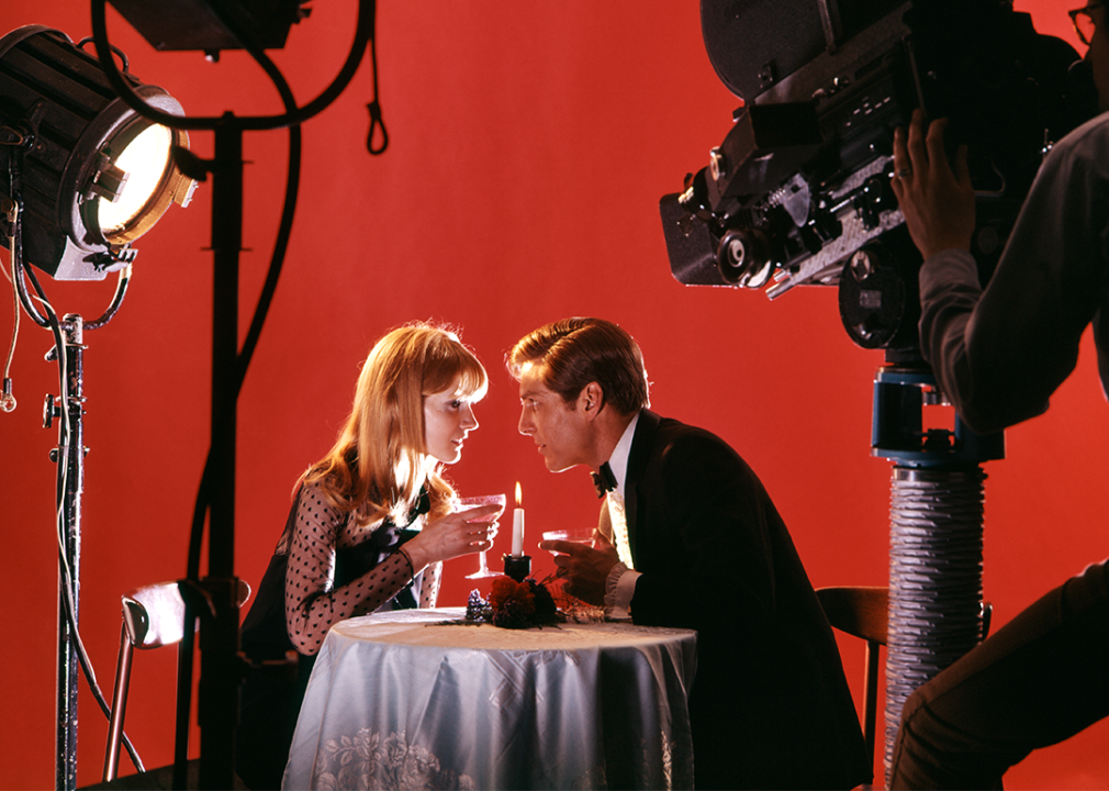 Television film set with man and woman on a date.
