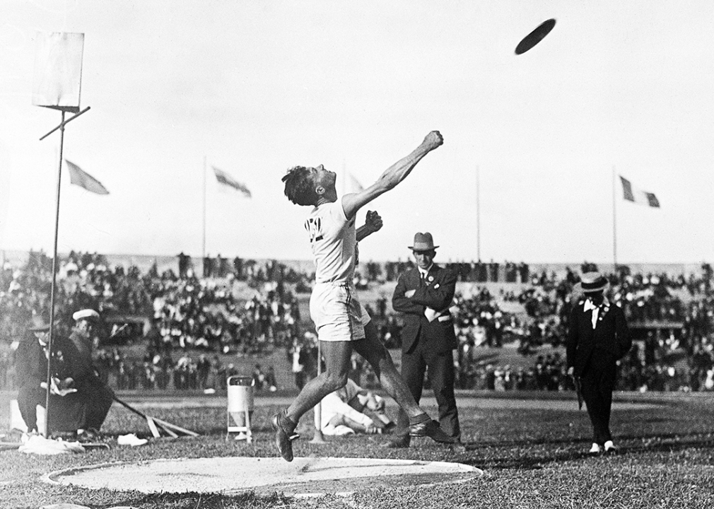 Bud Houser throws the discus.
