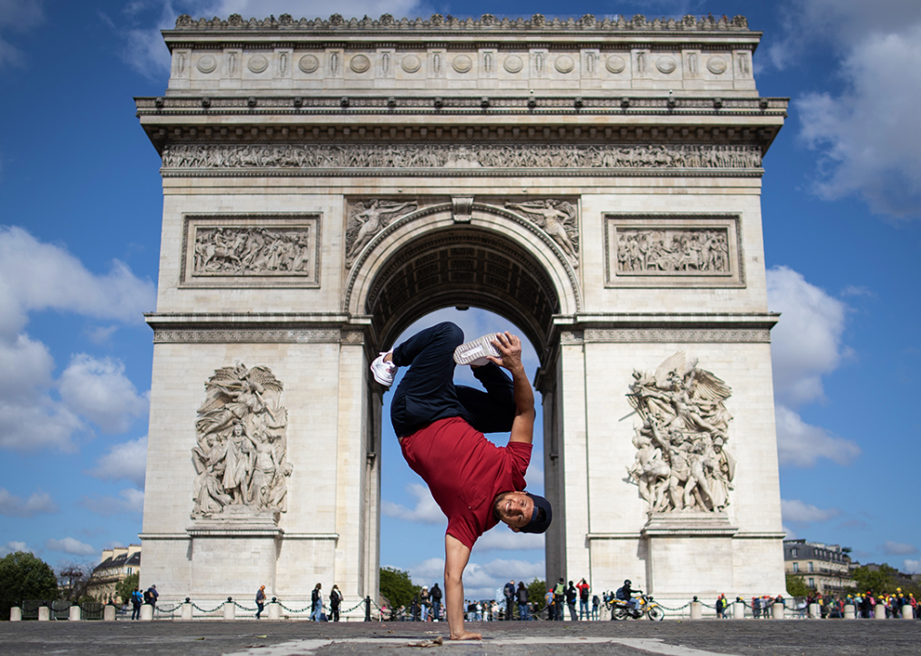 B-boy Mounir of France poses in front of the Arc de Triomphe.