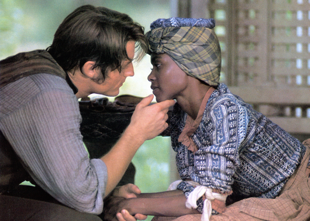 Perry King leaning in to kiss Brenda Sykes in a scene from the film ‘Mandingo