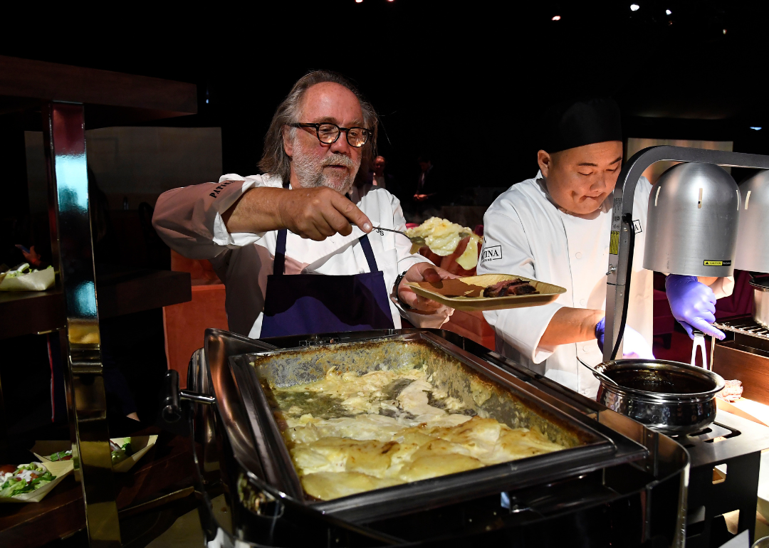 Joachim Splichal prepares a plate at the Emmy Awards Governors Ball.