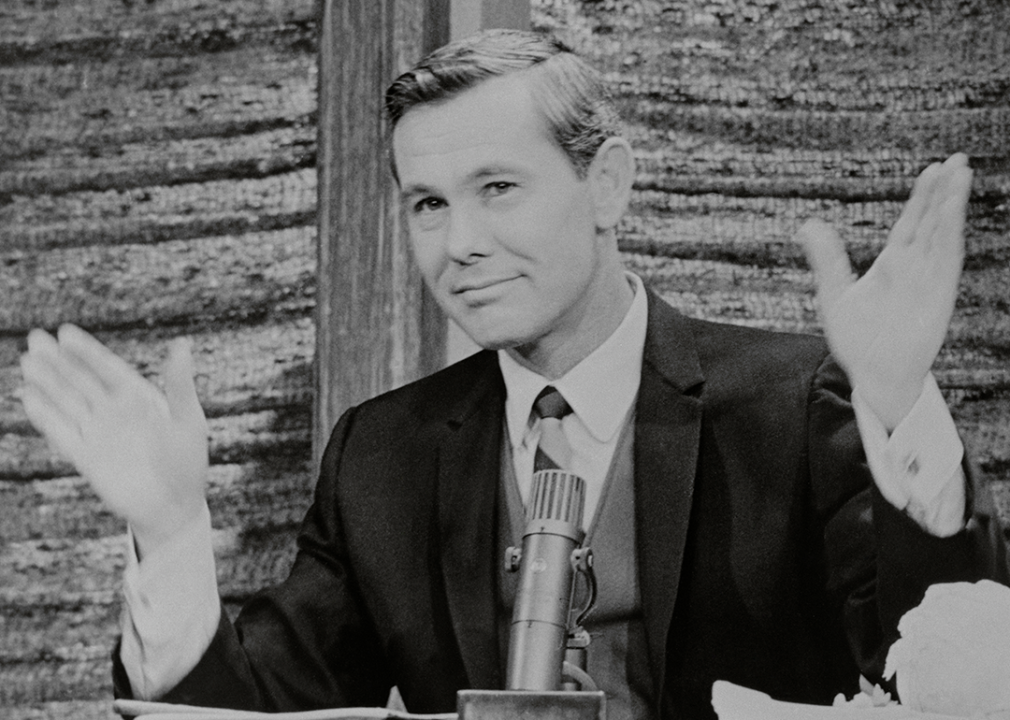 Johnny Carson behind desk during The Tonight Show.