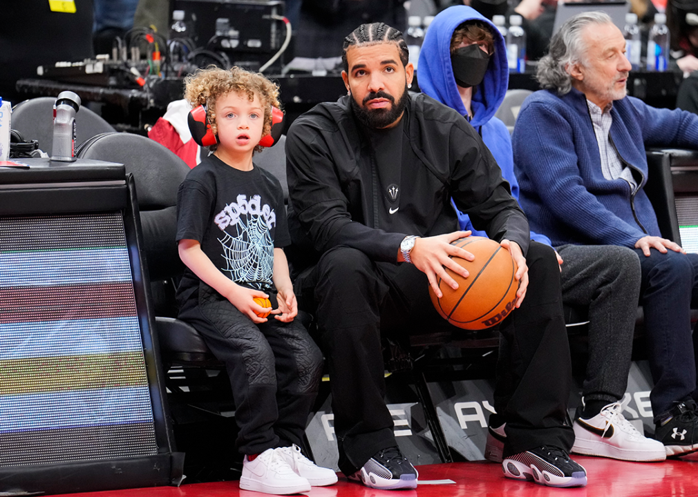 Drake and son attend a Toronto Raptors game.