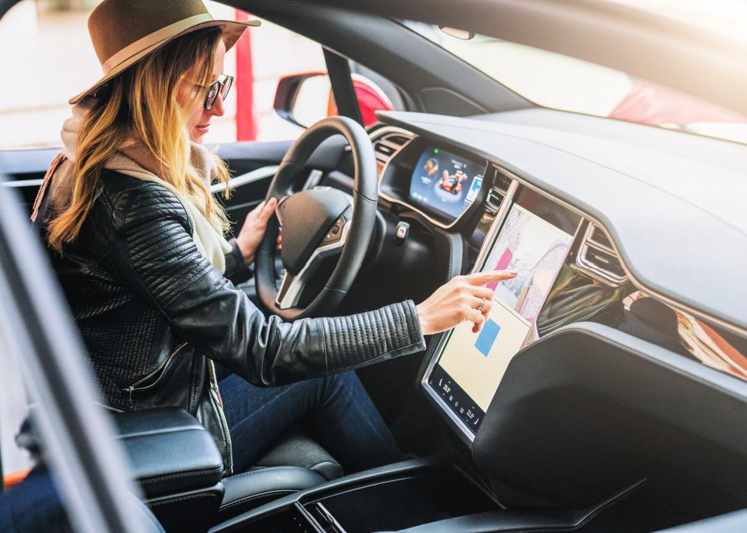 Person operates electronic dashboard in Tesla