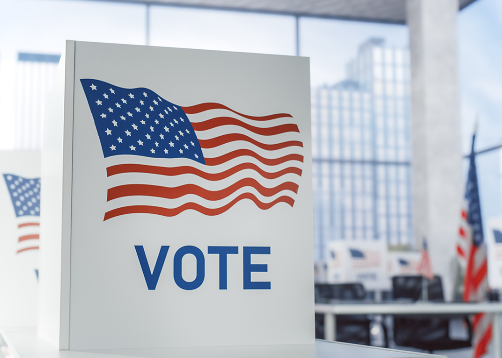 Voting booth with American Flag at polling place.