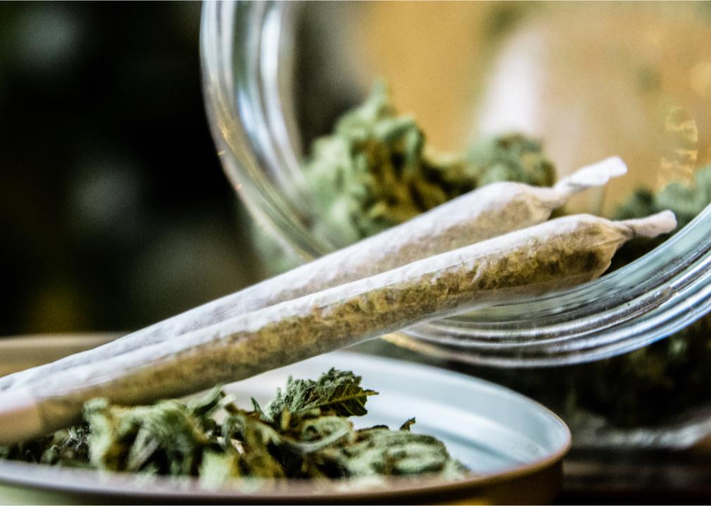 Marijuana joints next to a jar