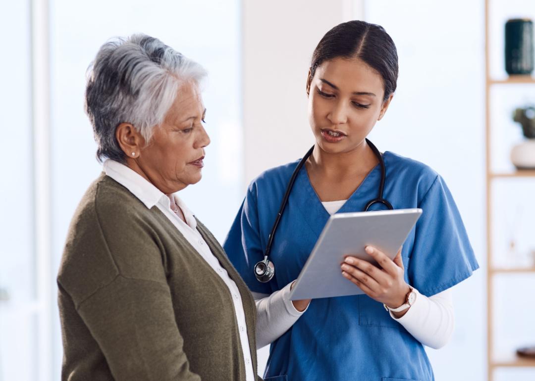 Nurse a digital tablet during consultation.