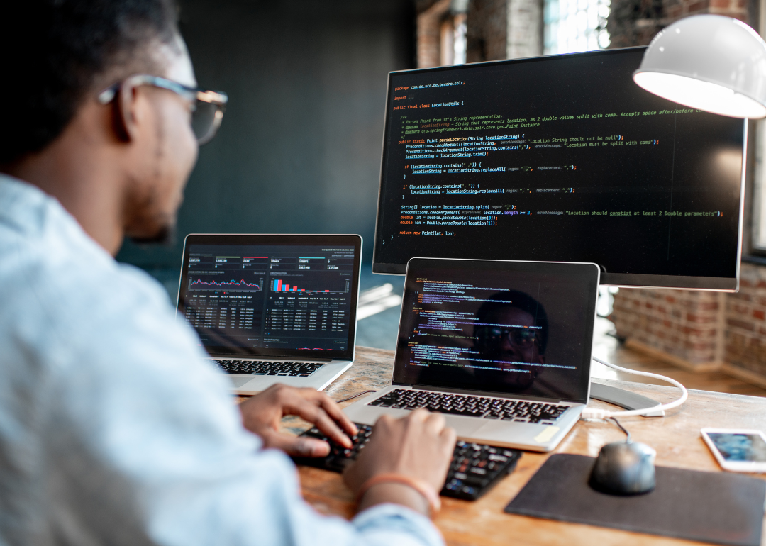 Cybersecurity professional working at computer.