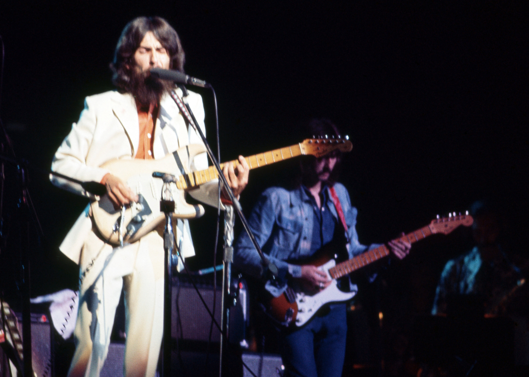 George Harrison and Eric Clapton perform at the Concert for Bangladesh.
