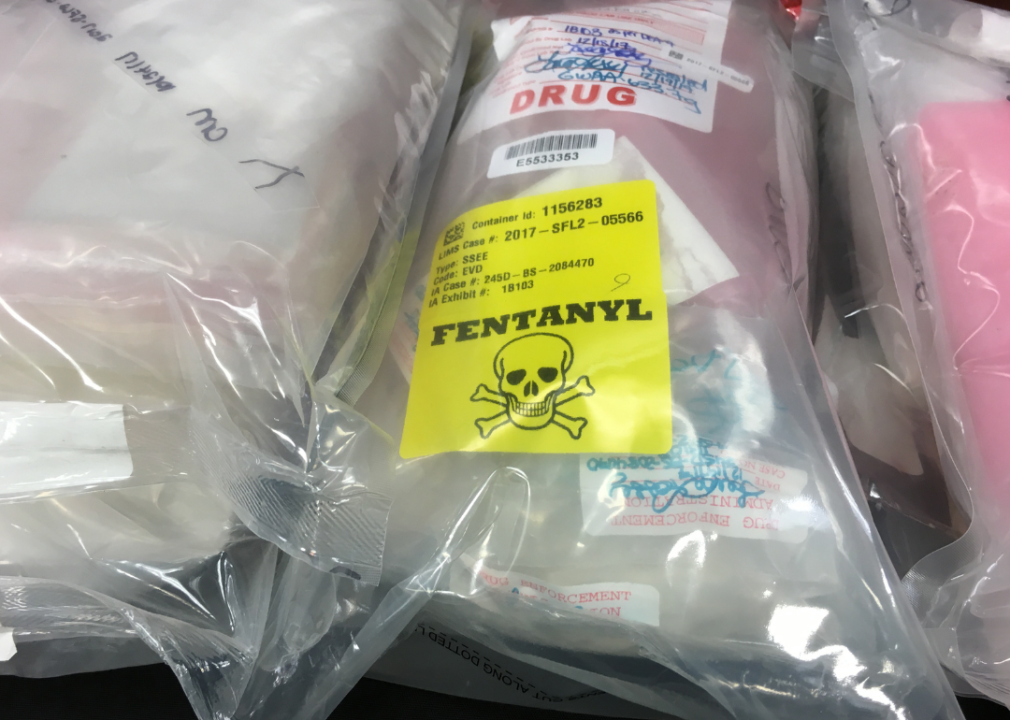 Fentanyl label on bags of drugs displayed during a press conference.