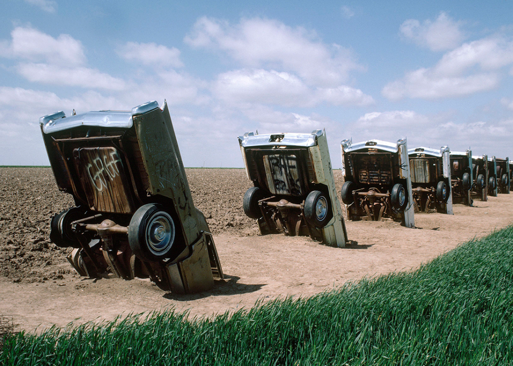 Close up of Cadillac Ranch Scuplture in field.
