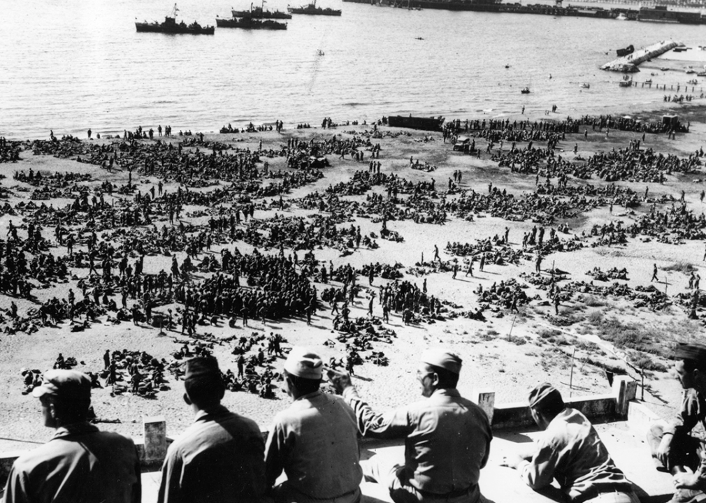 Thousands of US troops waiting on an Italian beach to board landing craft for Southern France.