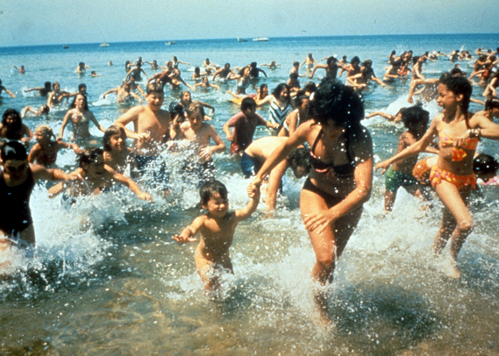Crowds run out of the water in a scene from ‘Jaws