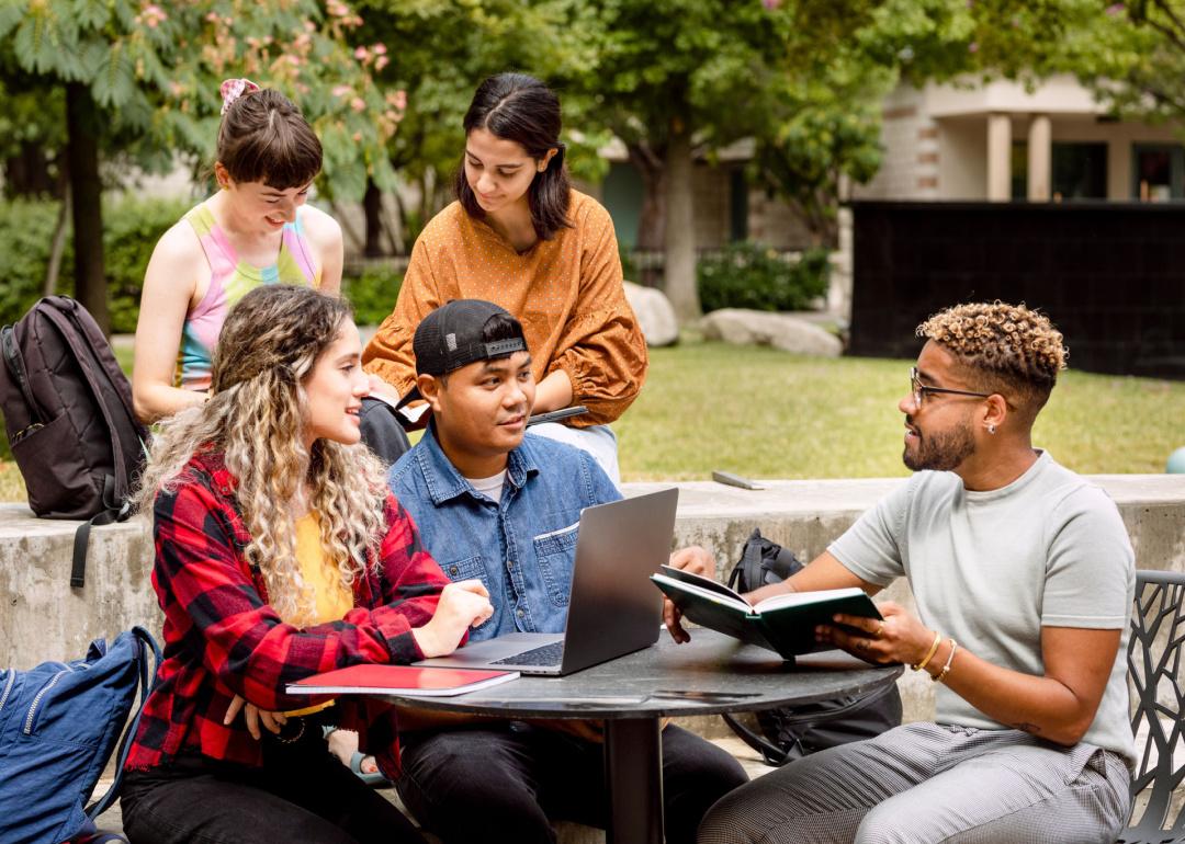 Students studying together outside.