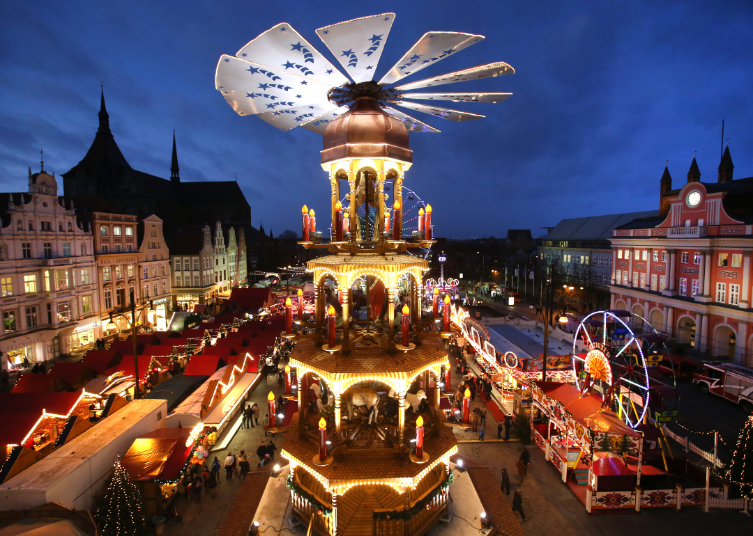 Visitors walk through the Christmas market in Rostock.