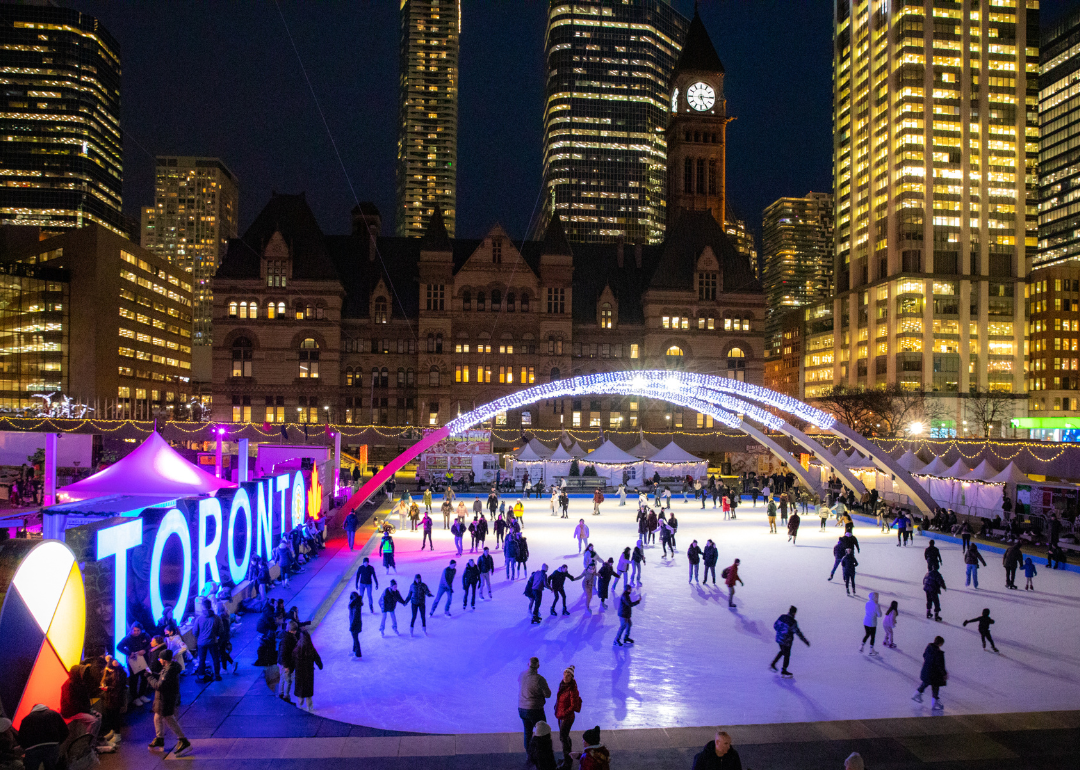 People ice skating at the annual Christmas market in Toronto.