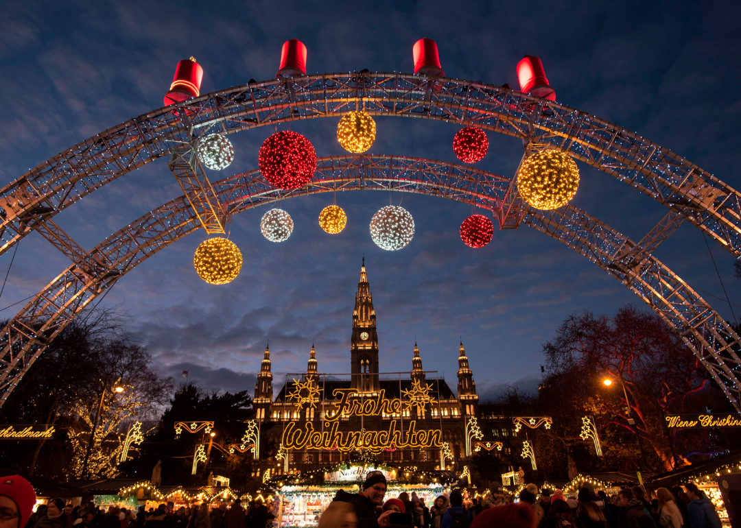 Christmas lights decorate the market and the City Hall in Vienna.