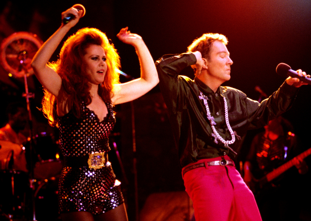 Kate Pierson and Fred Schneider of the B-52s perform onstage.
