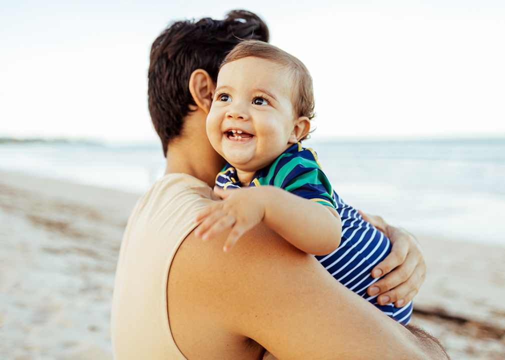 Father and son on beach.