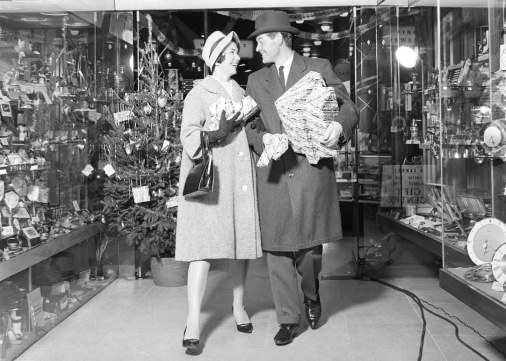 Couple leaving store with packages.