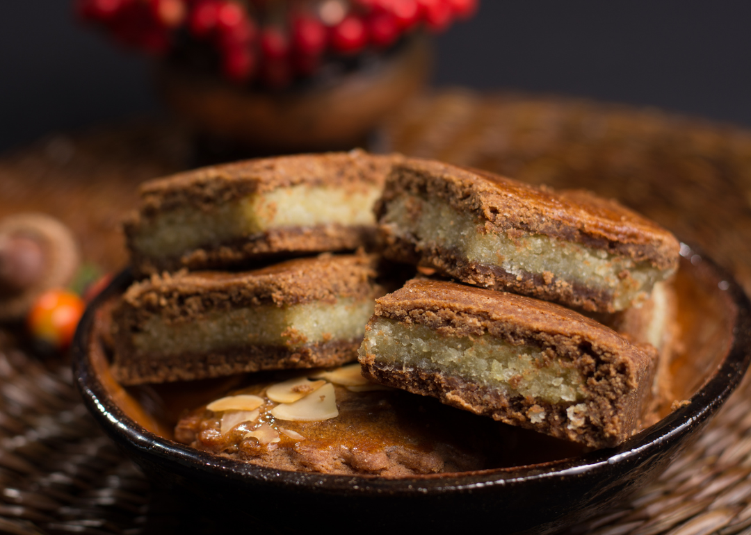 Almond paste stuffed gingerbread cookies on plate.