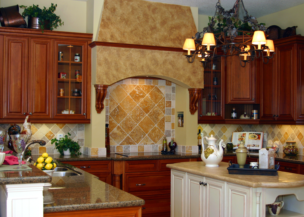 A Tuscan-style kitchen with tile and a center island.