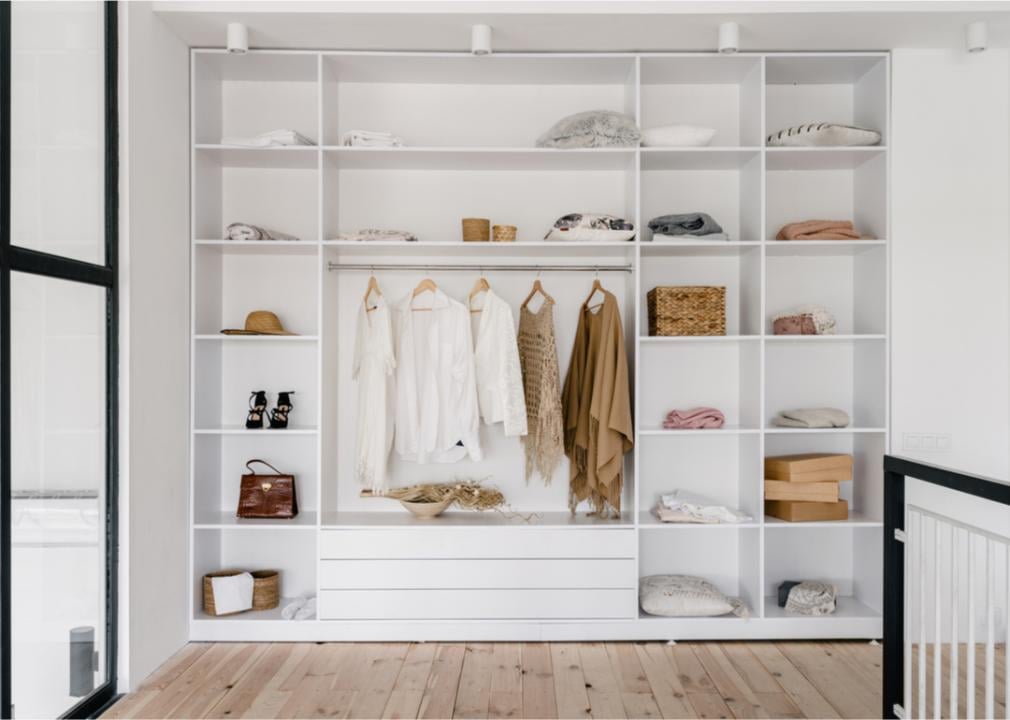 Large closet and dressing area with clothes