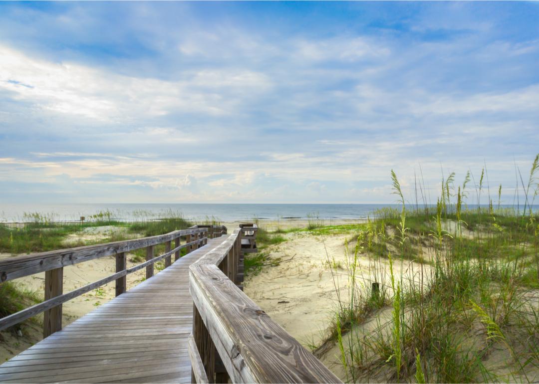 A bridge leading to a sandy beach in Dutch Island, Georgia.