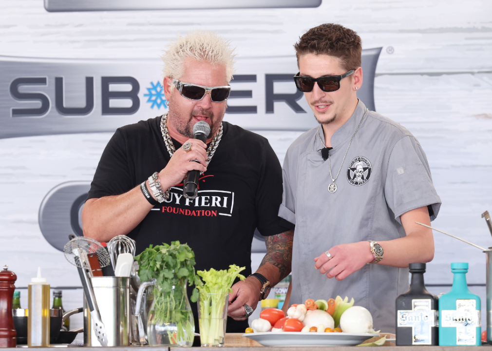 Guy Fieri and Hunter Fieri speak at a food and wine festival