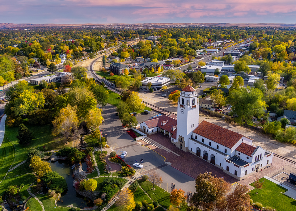 Aerial view of autumn trees and a train depot in Boise.