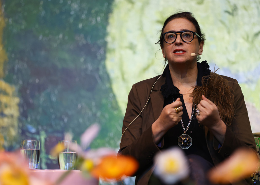 India Mahdavi speaks at event.