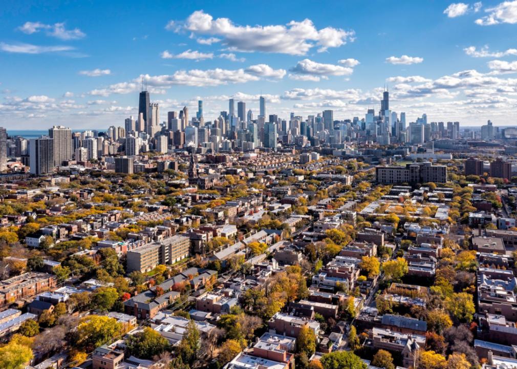 Chicago neighborhood buildings and city skyline on a sunny autumn day.
