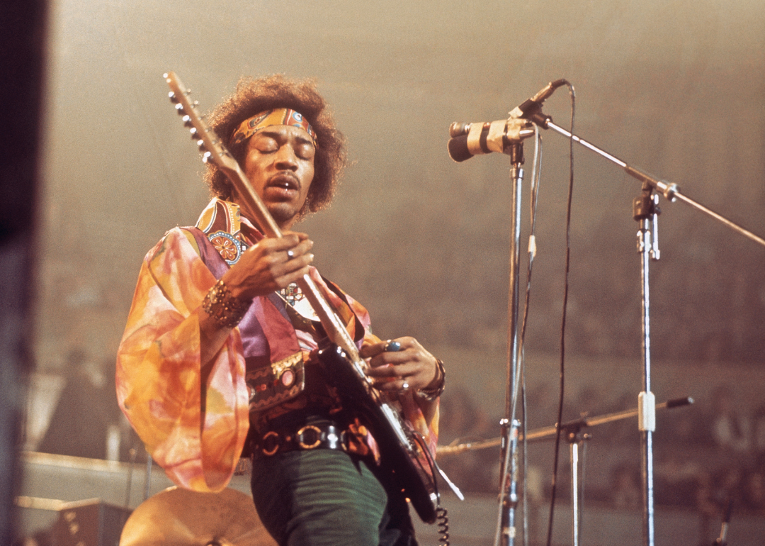 Jimi Hendrix performs live onstage.