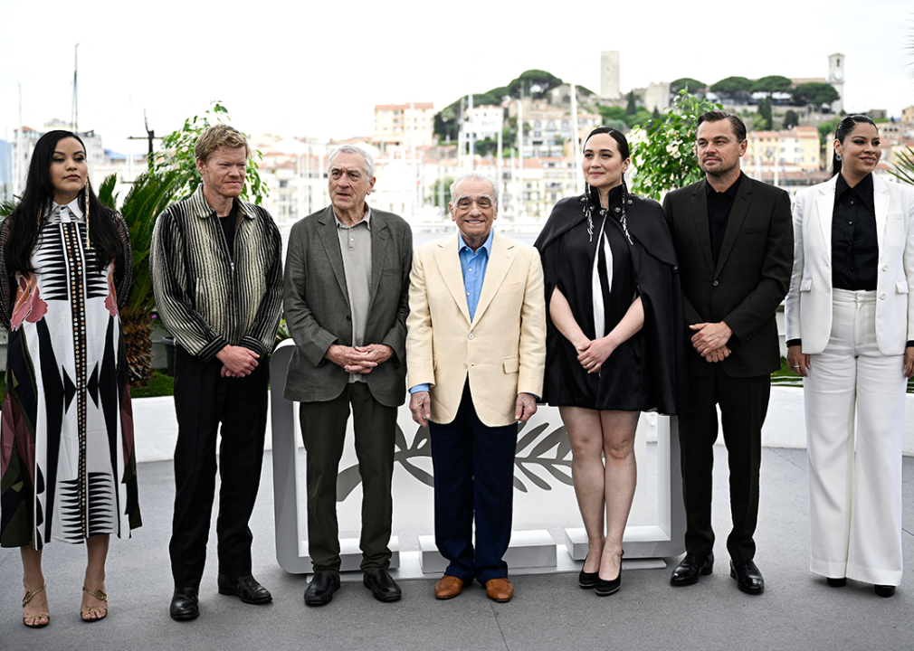 Martin Scorsese, Robert De Niro, Leonardo DiCaprio, and Lily Gladstone pose at Cannes.