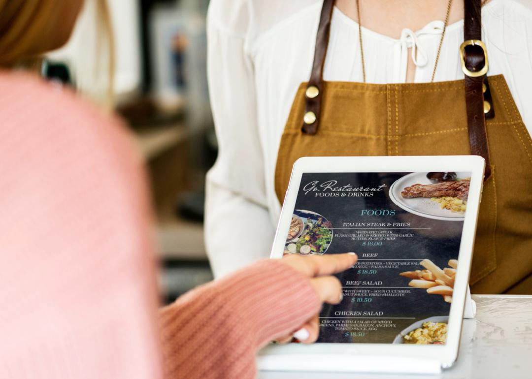 Customer placing order with tablet