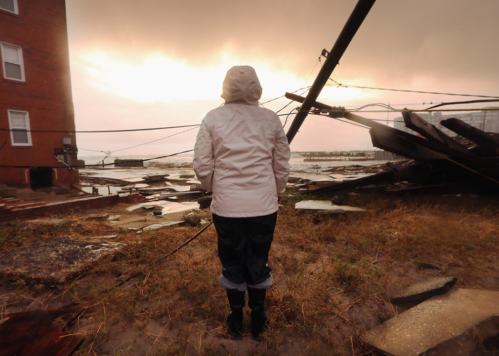 A resident stands among damage from Hurricane Sandy in Atlantic City, New Jersey.