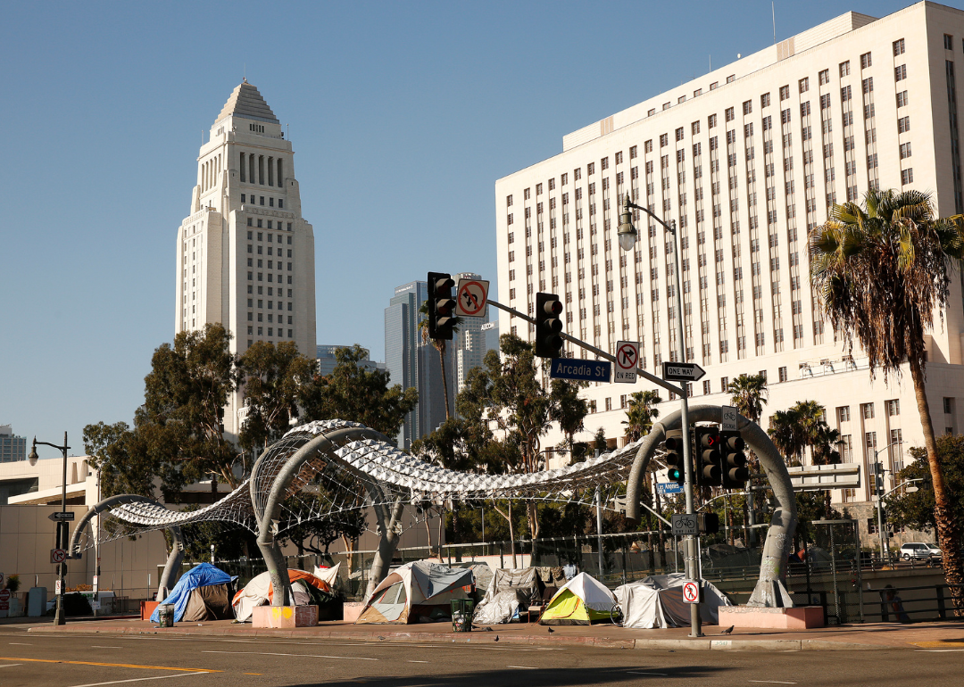 Homeless tents along Los Angeles Street with City Hall in background