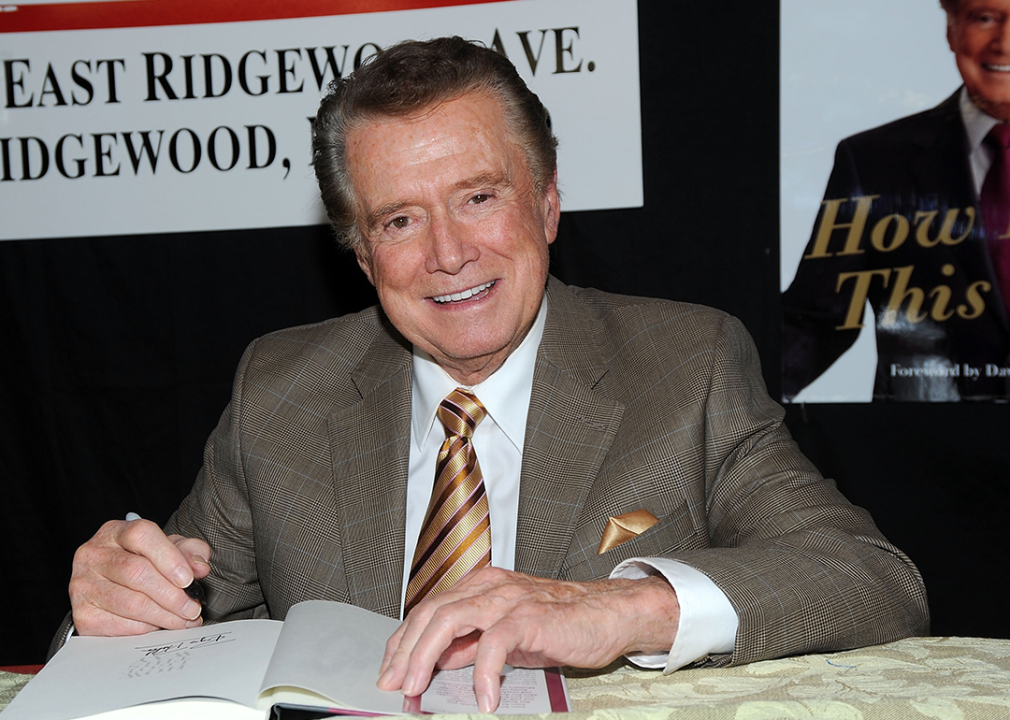 Regis Philbin signs his book, How I Got This Way, at a promotional event.