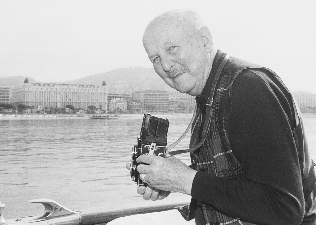 Director Michael Powel taking pictures of the Promenade de la Croisette during the Cannes Film Festival.