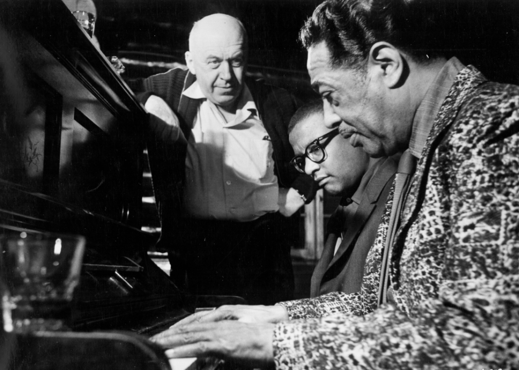 Otto Preminger looks on as Duke Ellington composes the score for ‘Anantomy Of A Murder’.
