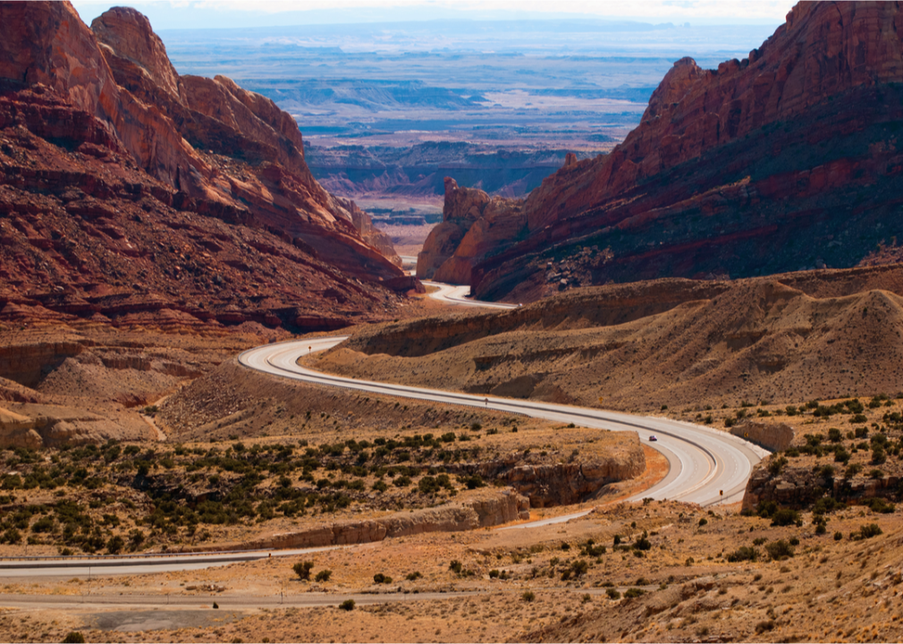 Winding road through desert canyon.