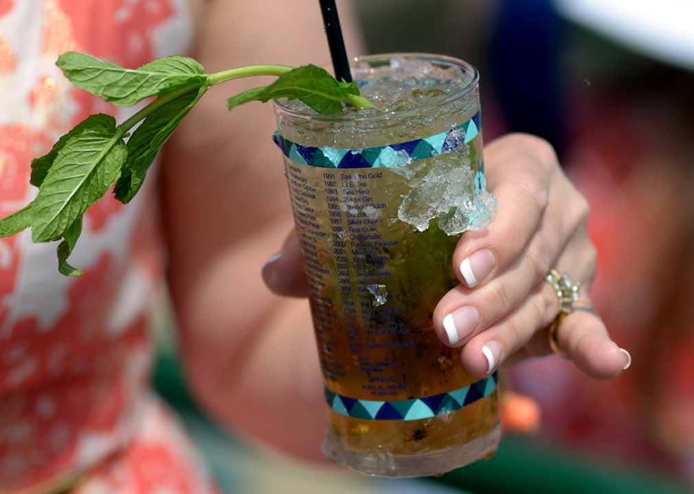 Detailed view of hand holding a Mint Julep.