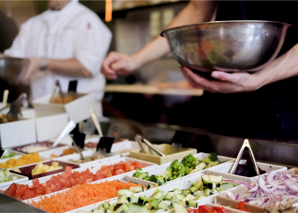 Chef preparing salad bar