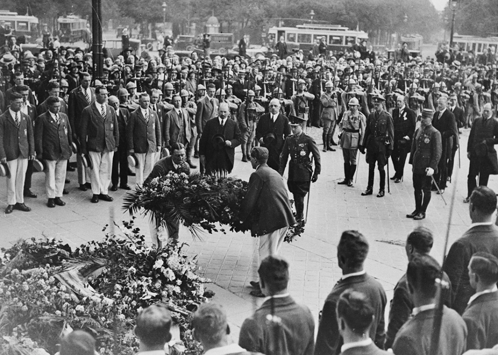 Prince Edward watches as members of the Great Britain Olympic team lay a wreath on the Tomb of the Unknown Soldier.