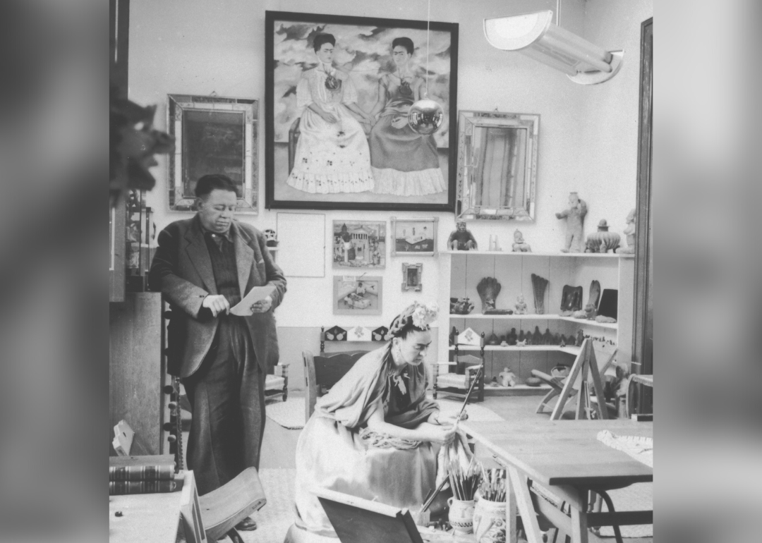 Frida Kahlo and Diego Rivera in studio.