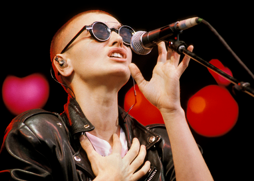 Sinead O’Connor performing onstage.